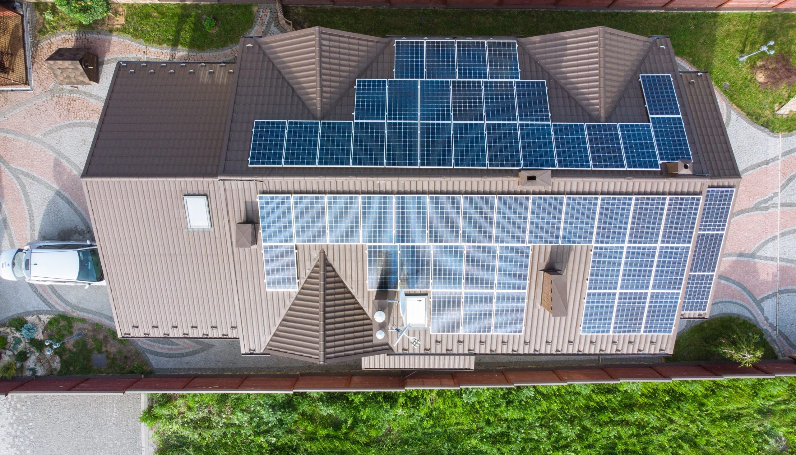 aerial view of house with solar roof. clean energy